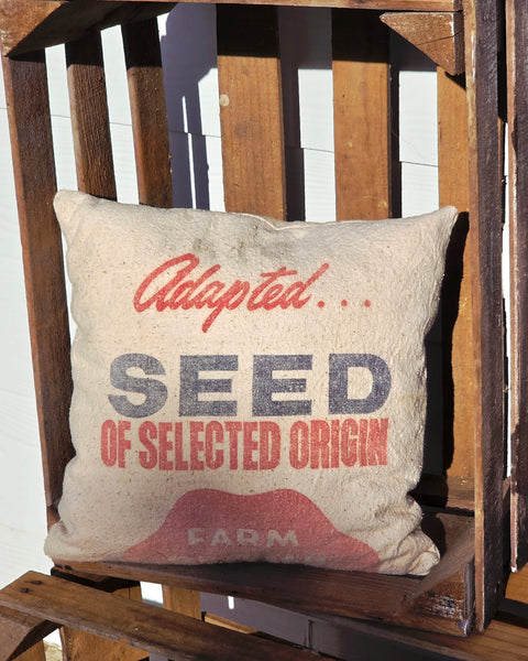 Quilted Pumpkin Pillow on vintage grain sack